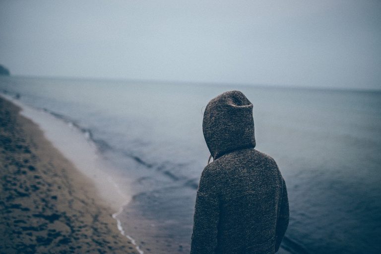 Reflecting by ocean
